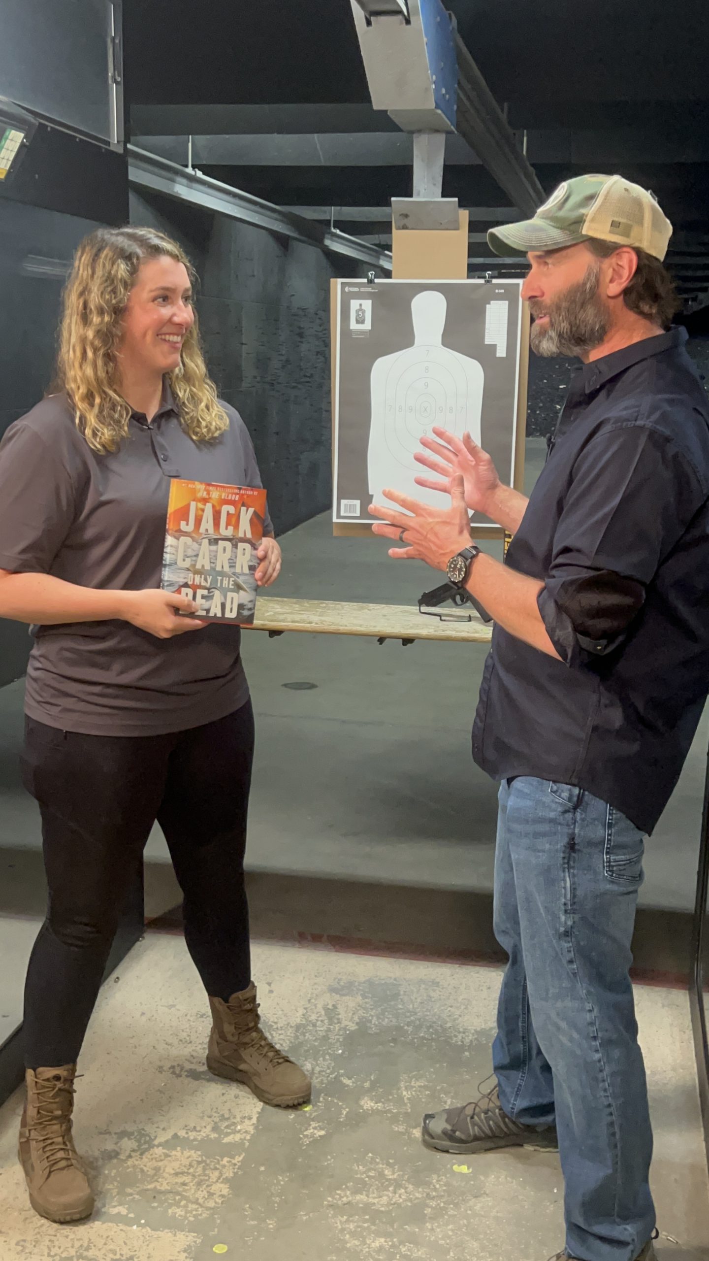 Jack Carr and Kenzie holding the Only the Dead book